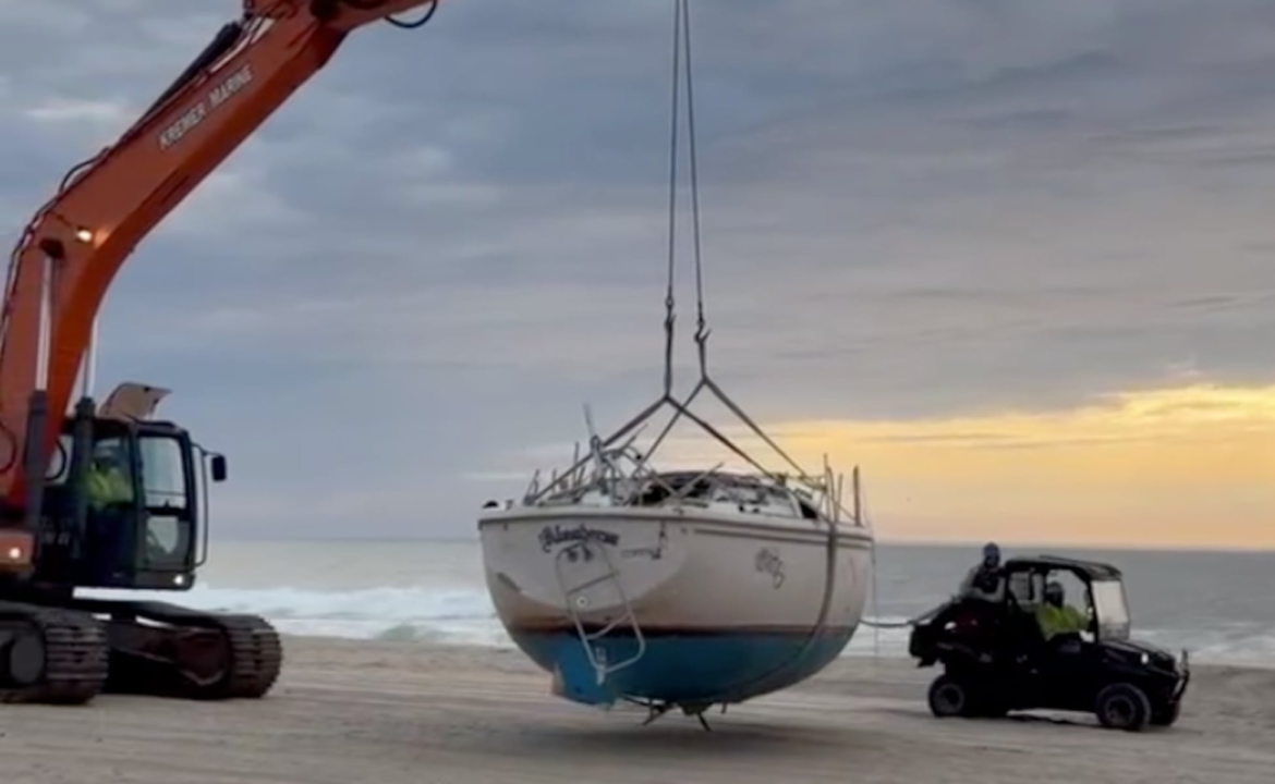 The abandoned boat in Sea Girt is finally being hauled away at taxpayers' expense.