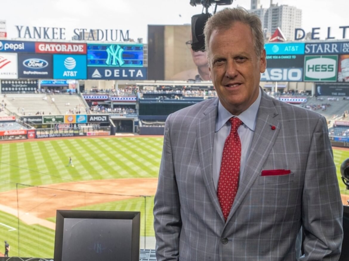 Michael Kay, YES Network announcer, poses for a portrait in the broadcast booth before the start of a baseball game. (AP Photo/Mary Altaffer)