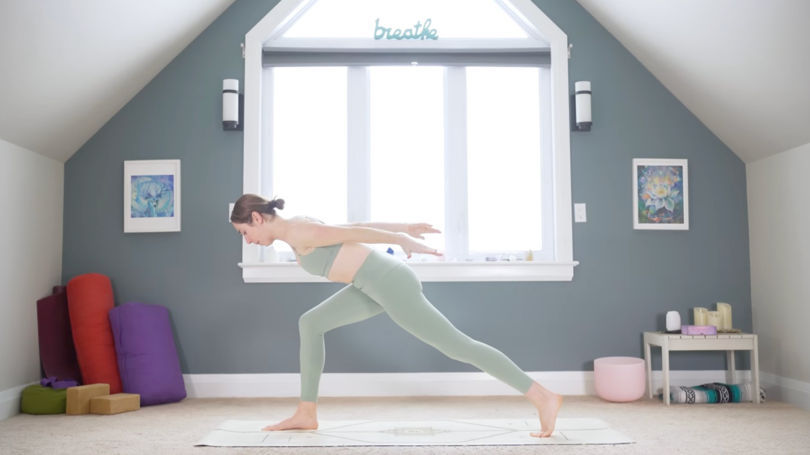 Woman in High Lunge leaning her chest forward and reaching her arms behind her