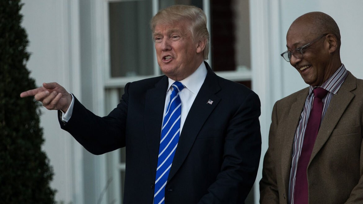 Donald Trump shares a laugh with civil rights icon Bob Woodson.
