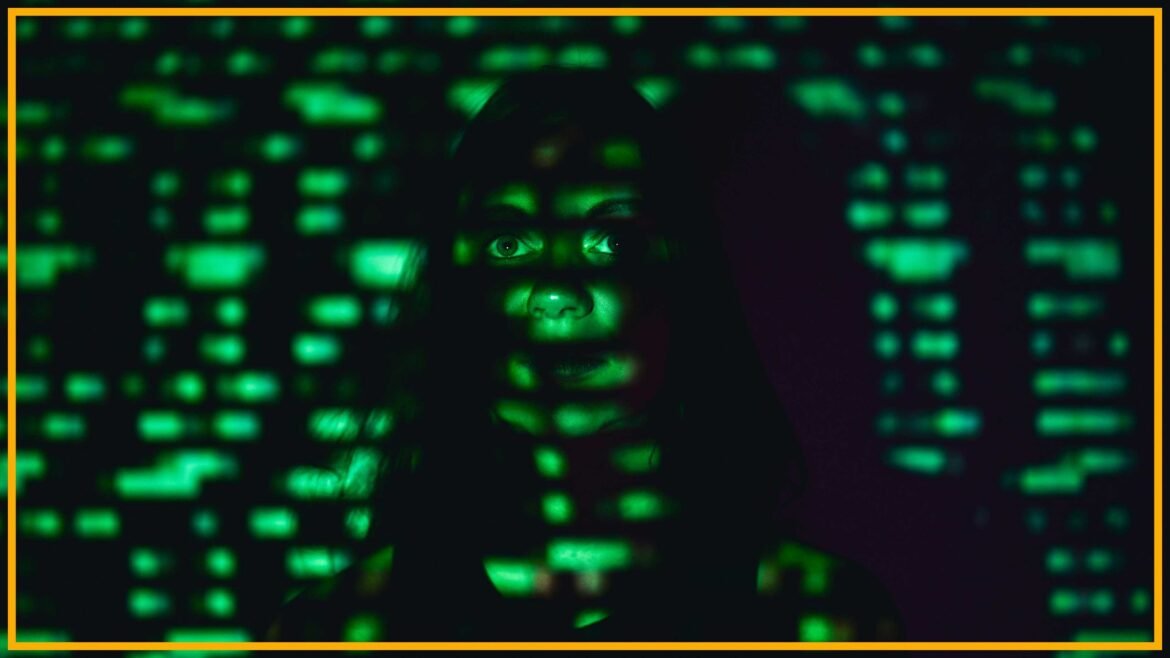Woman's face glowing with green futuristic data projection