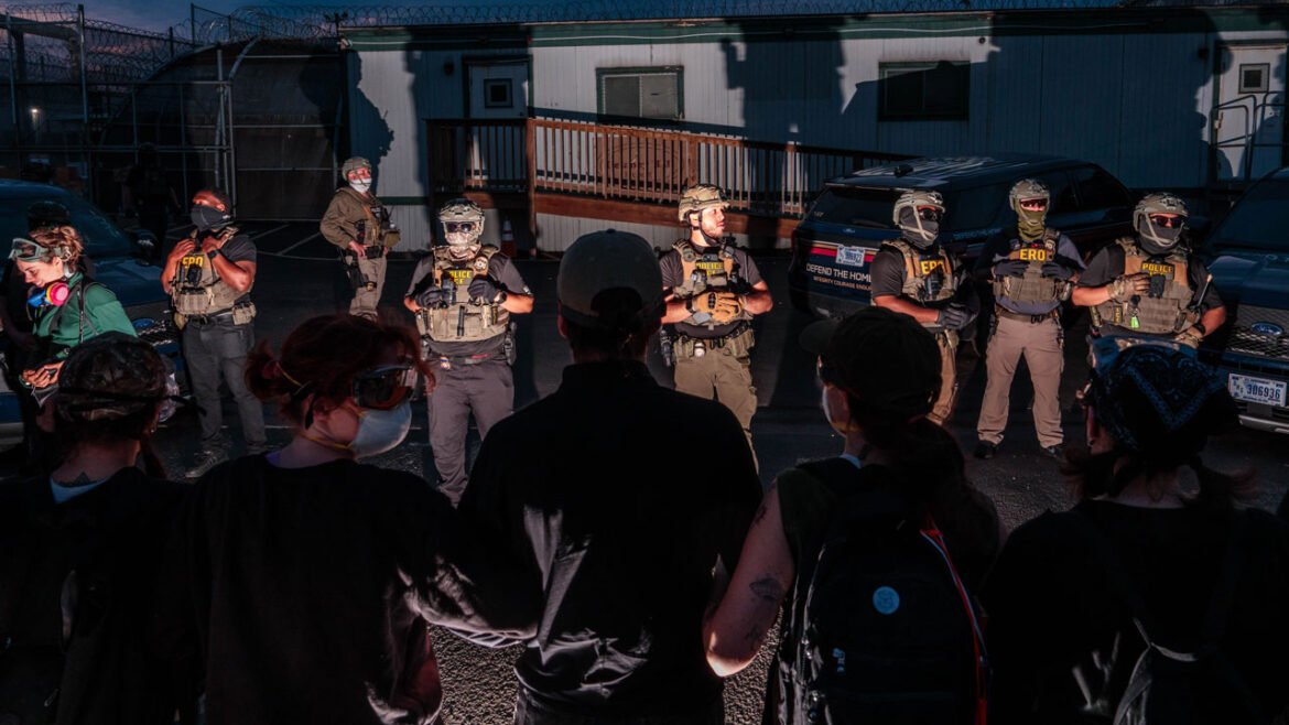 Protesters face off with ICE agents outside the federal immigration center at Delaney Hall, where ICE is housing detained immigrants on May 27, 2026 in Newark, New Jersey. The ongoing protests, which became tense over the holiday weekend, come amid reports of a hunger strike by detainees. (Photo by Adam Gray/Getty Images)