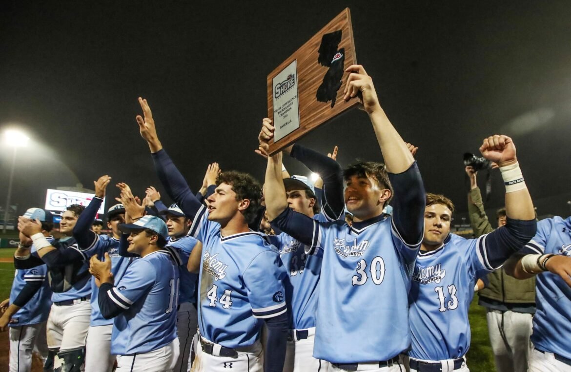 Dan Pardini (30) of Christian Brothers celebrates with the trophy after winning the Shore Conference Tournament baseball final between Rumson-Fair Haven and Christian Brothers at ShoreTown Ballpark in Lakewood, NJ on 5/24/26.