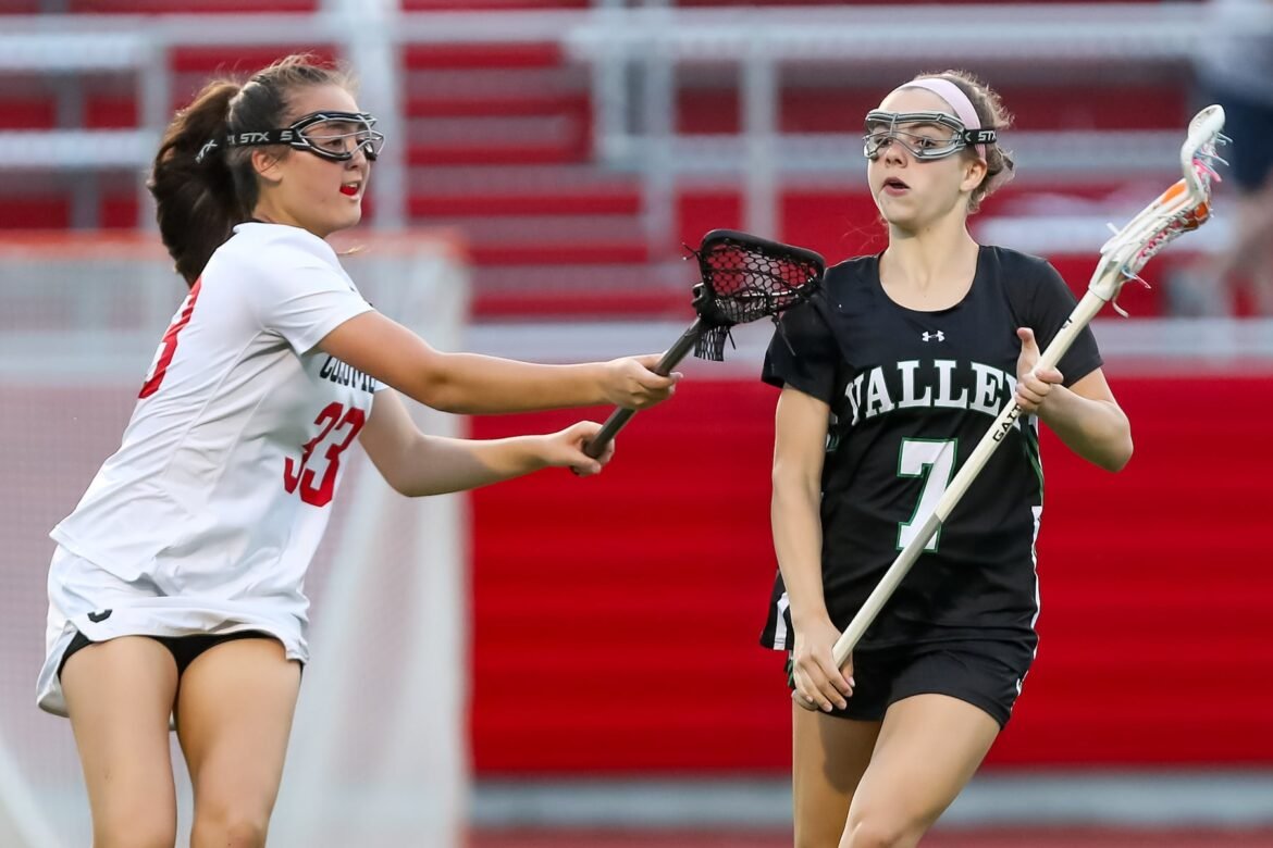 Mia Boretti (7) of Pascack Valley looks to get pat Amelia Burroughs (33) of Columbia during the girls lacrosse game at Underhill Turf Field in Maplewood NJ on Monday, April 29, 2024