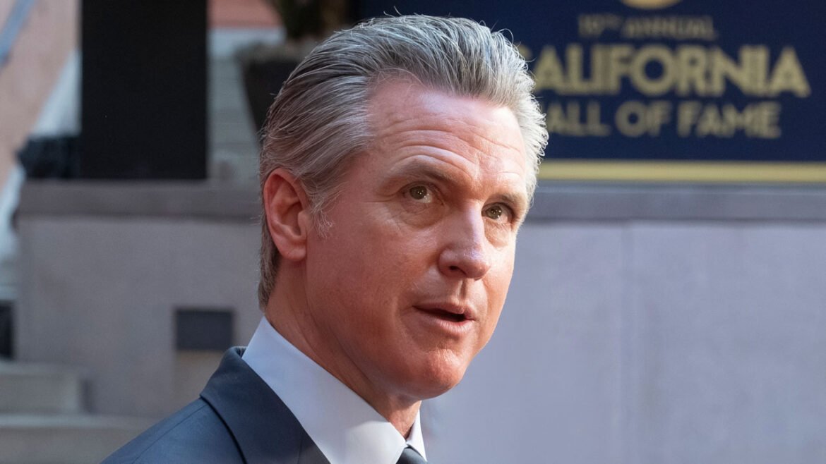 Close-up of Gavin Newsom looking up.