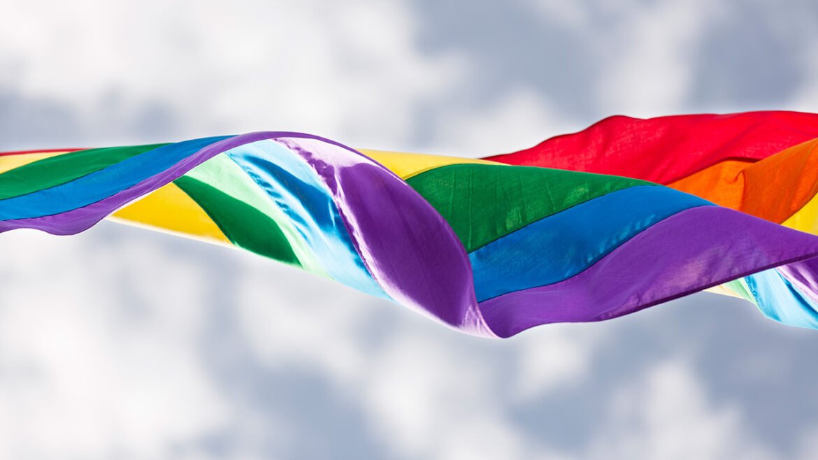 a pride flag in the wind