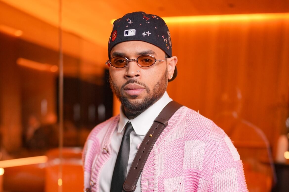 Chris Brown's former housekeeper is fighting to have photos of injuries she sustained in bloody dog attack at his Los Angeles, submitted as evidence for upcoming trial. He can be seen here posing at the Louis Vuitton Men's Fall/Winter 2026 fashion show as part of Paris Men's Fashion Week held at Foundation Louis Vuitton on Jan. 20, in Paris, France. (Photo by Swan Gallet/WWD via Getty Images)