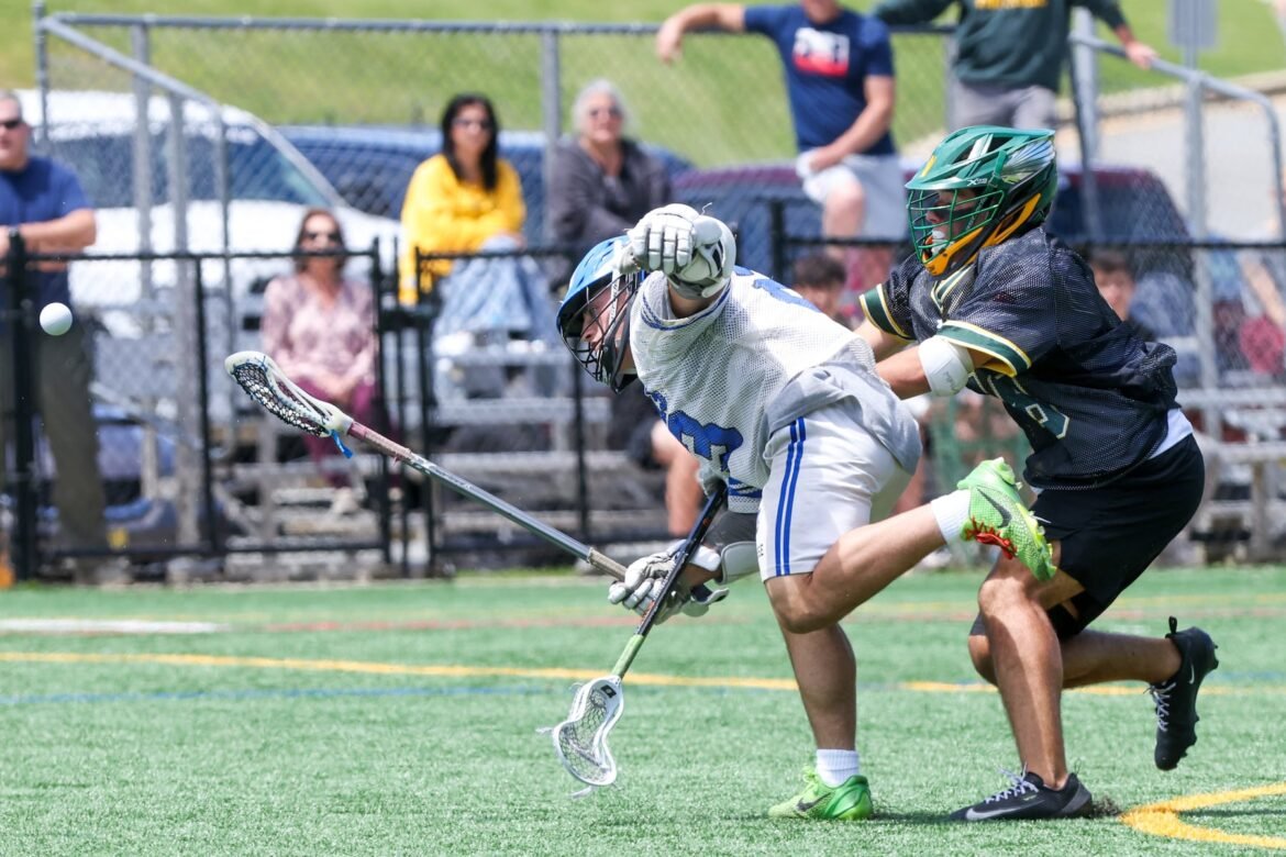 Max Martins (18) of Morris Knolls and Carmine Carusone (23) of Princeton battle for the face off during the NJSIAA, North Jersey, Group 3, first round boys lacrosse game at Morris Knolls High School in Rockaway, NJ on Thursday, May 28, 2026.