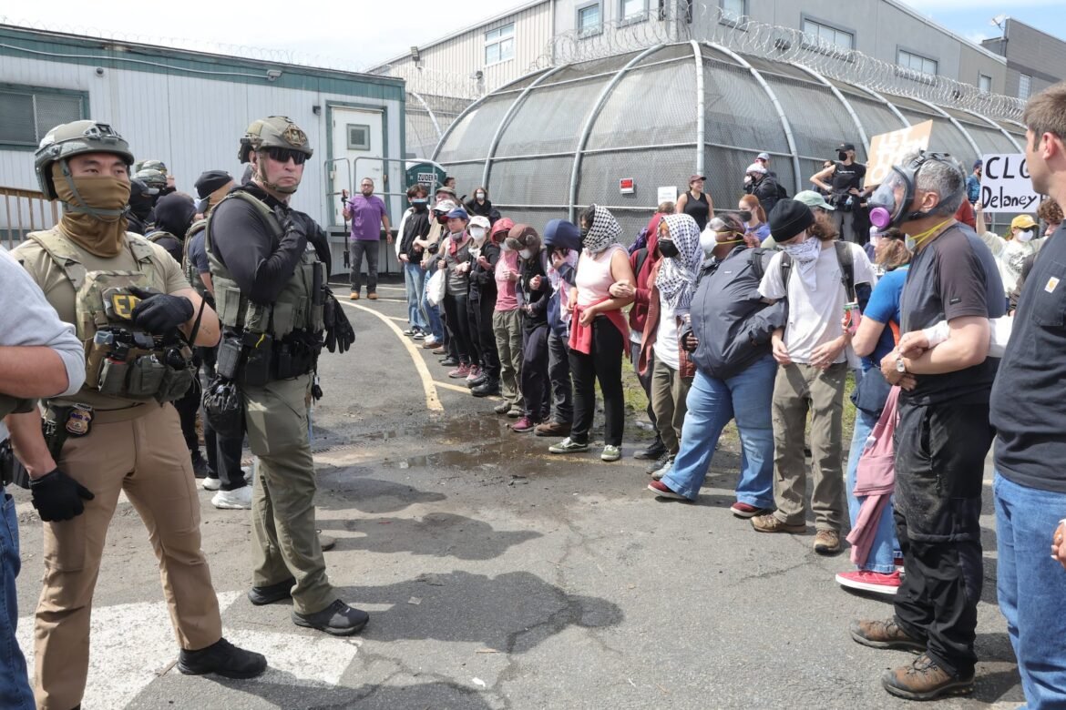 ICE officers try to move protesters to clear access through the gates of their facility and keep the main road open. Protesters clashed with ICE officers outside Delaney Hall where undocumented immigrants are being detained. Governor Sherrill, Senator Andy Kim, Rep. Frank Pallone and Rep. Nellie Pou met with ICE officials to try to see the detainees and work with protesters and ICE to tone down the conflicted outside Delaney Hall in Newark, New Jersey on Monday, May 25, 2026. 