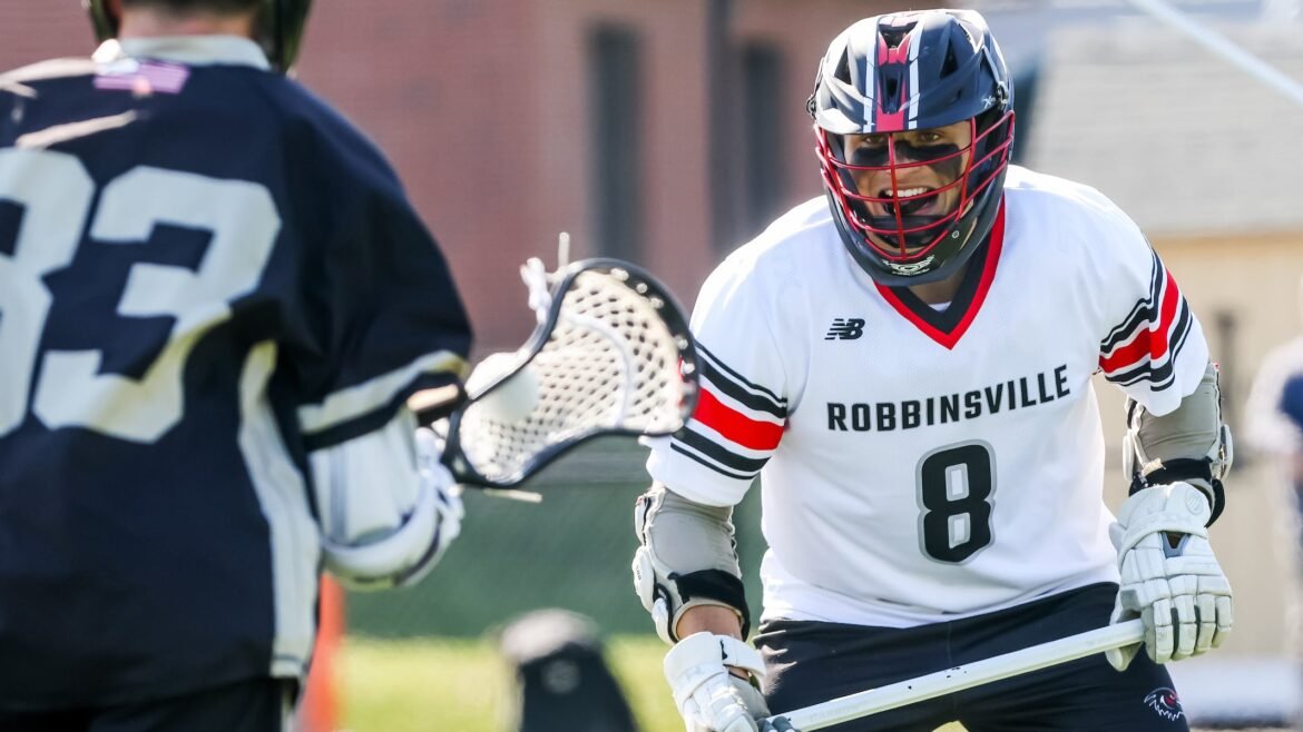 Alex Giordano (8) of Robbinsville defends Ryan Batcha (23) of Hopewell Valley during the boys lacrosse game at Hopewell Valley High School in Pennington, NJ on Tuesday April 21, 2026.