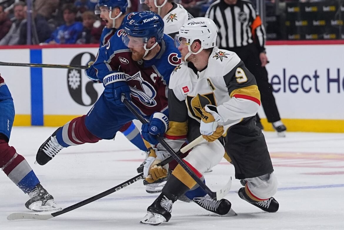 Colorado Avalanche left wing Gabriel Landeskog, left, checks Vegas Golden Knights center Jack Eichel during the second period in Game 1 of the Western Conference finals NHL hockey Stanley Cup playoff series Wednesday, May 20, 2026, in Denver. (AP Photo/David Zalubowski)