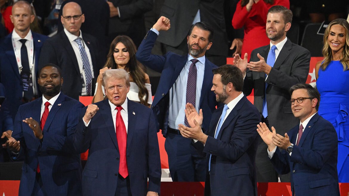 US former President and 2024 Republican presidential candidate Donald Trump (bottom, 2nd L) cheers alongside (from bottom L) US Representative of Florida Byron Donalds, US Senator from Ohio and 2024 Republican vice-president candidate J. D. Vance, and House Speaker Mike Johnson, (from top R) Co-chair of the Republican National Committee Lara Trump, son Eric Trump, son Donald Trump Jr., and US TV news personality Kimberly Guilfoyle as he arrives during the first day of the 2024 Republican National Convention at the Fiserv Forum