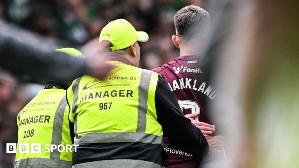  Hearts' Lawrence Shankland with stewards at full time during a William Hill Premiership match between Celtic and Heart of Midlothian at Celtic Park, on May 16, 2026, in Glasgow, Scotland.