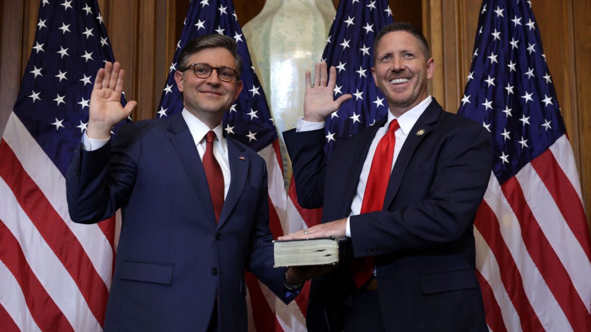 U.S. Speaker of the House Rep. Mike Johnson (R-LA) (L) participates in a ceremonial swearing-in with Rep. Josh Brecheen (R-OK) at the U.S. Capitol on January 3, 2025 in Washington, DC.