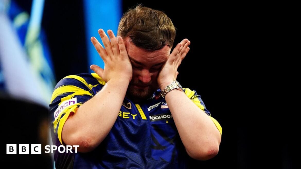 An emotional Luke Littler wipes away tears after beating Luke Humphries to win  the 2026 Premier League Darts