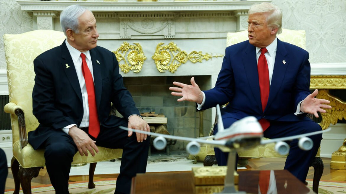 Donald Trump gestures to Benjamin Netanyahu as they sit in the Oval Office.