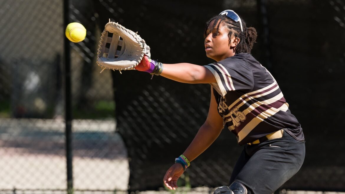 McNair catcher Jermirah Birchett takes a through at the plate during warmups before the Hudson County high school softball quarterfinals against Memorial on Tuesday in Jersey City. The Cougars clawed the Tigers, 5-1.  05/12/2026