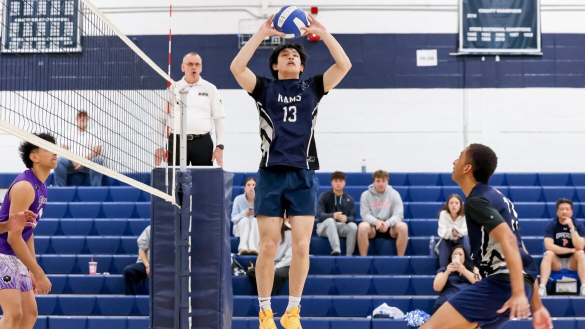 Cole Cantada (13) of Randolph sets the ball agains Monroe during the boys volleyball tri match at Randolph High School in Randolph, NJ on Friday, April 24, 2026.