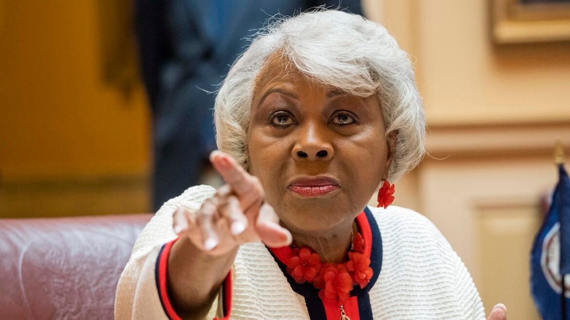 Sen. L. Louise Lucas points toward a camera.