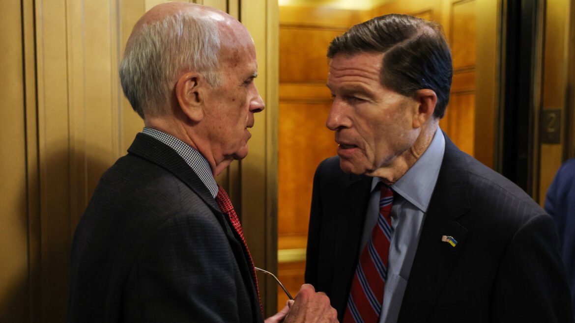 Sen. Peter Welch (D-VT) and Sen. Richard Blumenthal (D-CT) speak outside of the Senate Chambers.