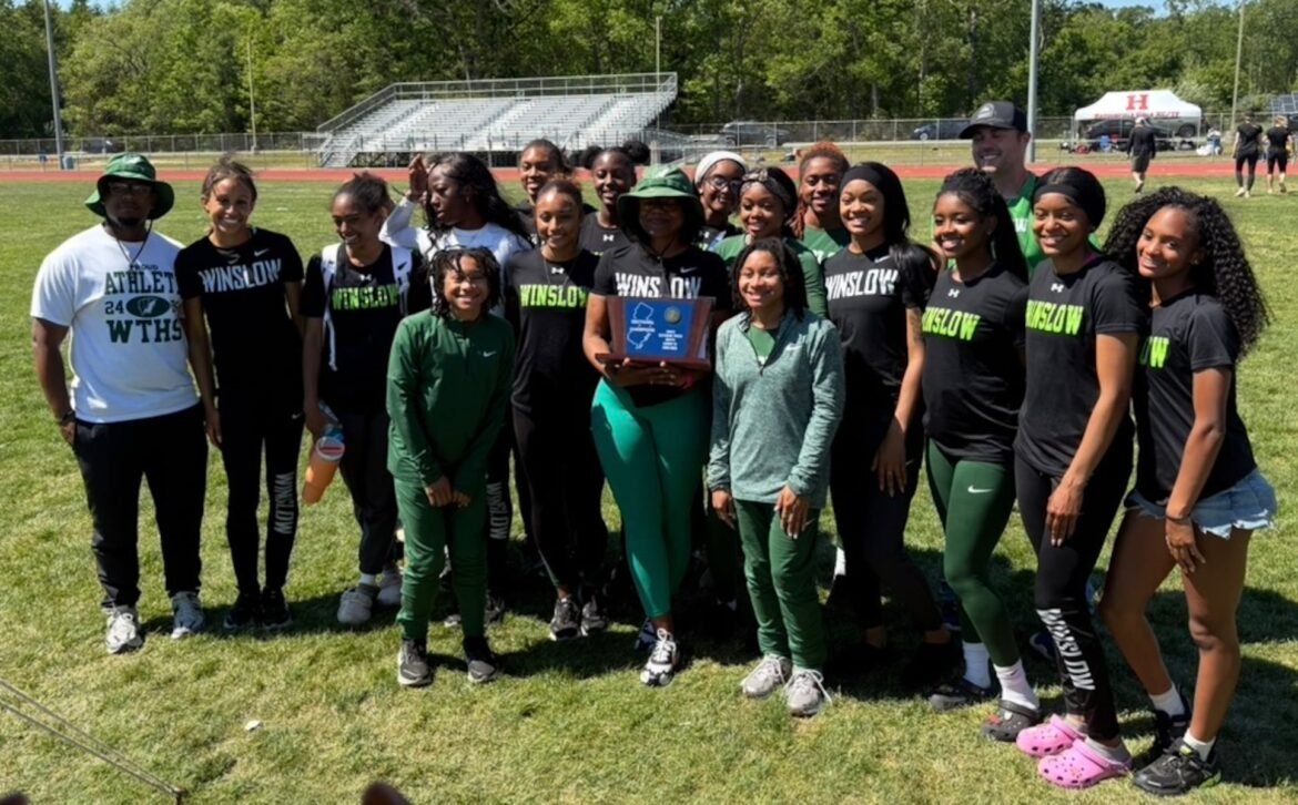 Winslow celebrates winning its fourth consecutive sectional title.