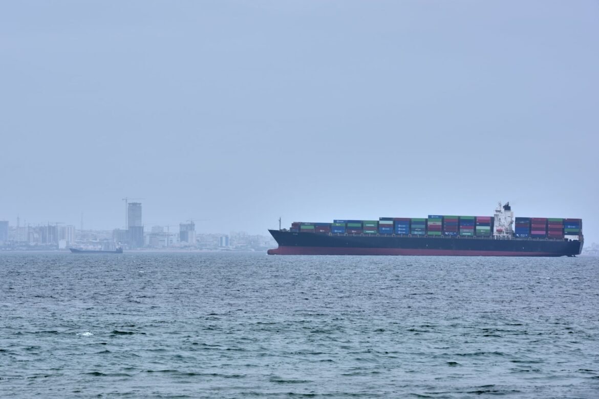 A container ship is seen in the Strait of Hormuz off the coast of Qeshm Island, Iran, Saturday, April 18, 2026. (AP Photo/Asghar Besharati)