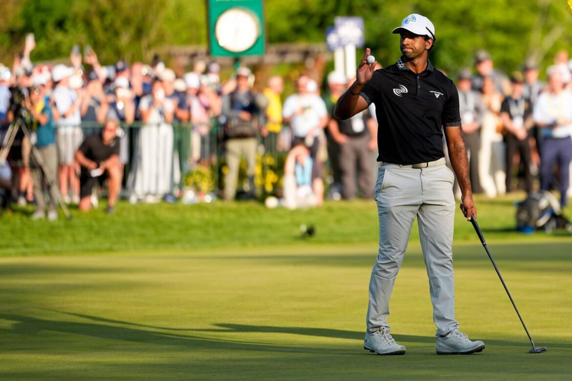 Aaron Rai, of England, waves after his round on the 18th green during the final round of the PGA Championship golf tournament at Aronimink Golf Club, Sunday, May 17, 2026, in Newtown Square, PA. (AP Photo/Carolyn Kaster)