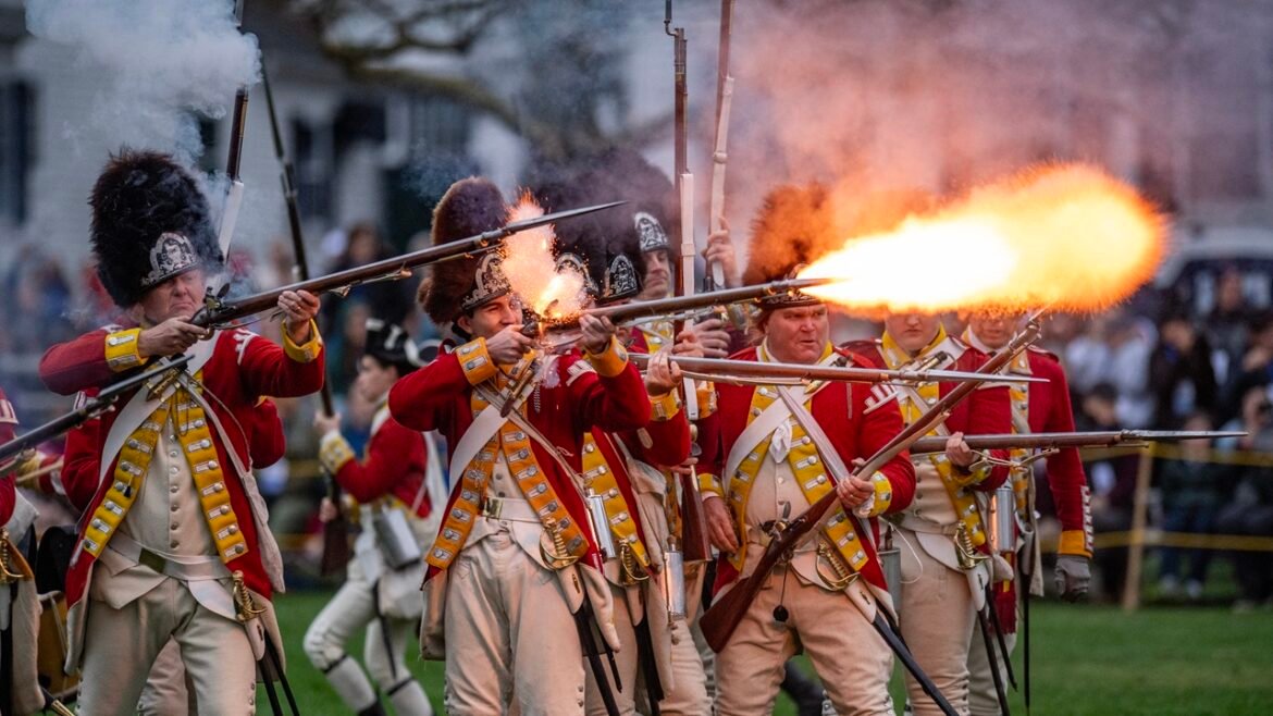 Revolutionary War reenactors firing guns