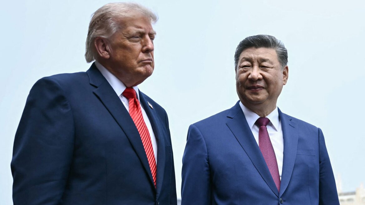Waist-high shot of President Donald Trump and Chinese President Xi Jinping against a pale blue sky.