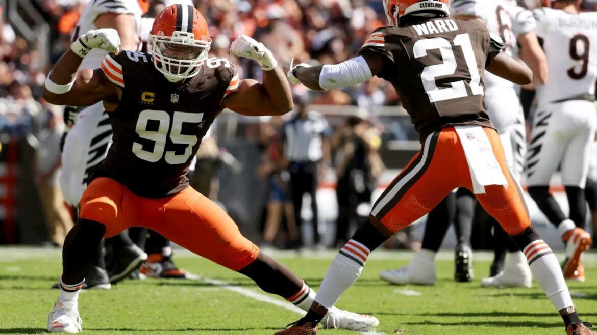 Cleveland Browns defensive end Myles Garrett (95) celebrates with cornerback Denzel Ward (21) after sacking Cincinnati Bengals quarterback Joe Burrow (9) during an NFL football game, Sunday, Sept. 7 2025, in Cleveland.