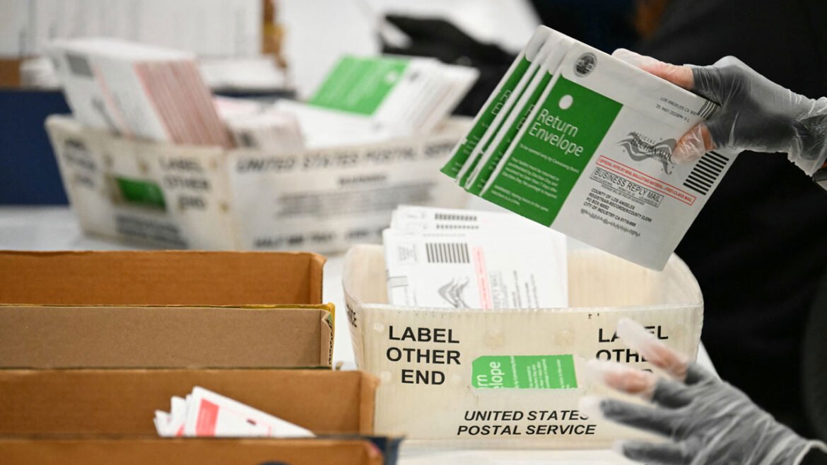 Election workers process mail-in ballots at the Los Angeles County Ballot Processing Center during California's state primary election in the City of Industry, California, on June 2, 2026.