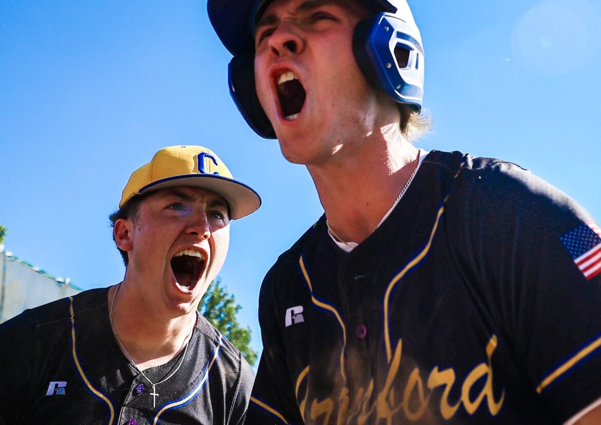 Cranford’s Patrick Berry, left, reacts as Brayden Fry (2) celebrates after scoring a run to increase their lead against North Hunterdon during the NJSIAA North 2 Group 3 baseball semifinal on June 3, 2026. 
