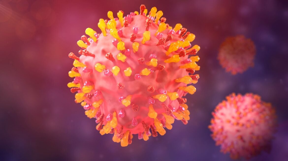 An illustration shows spiky spherical cells against a purple background