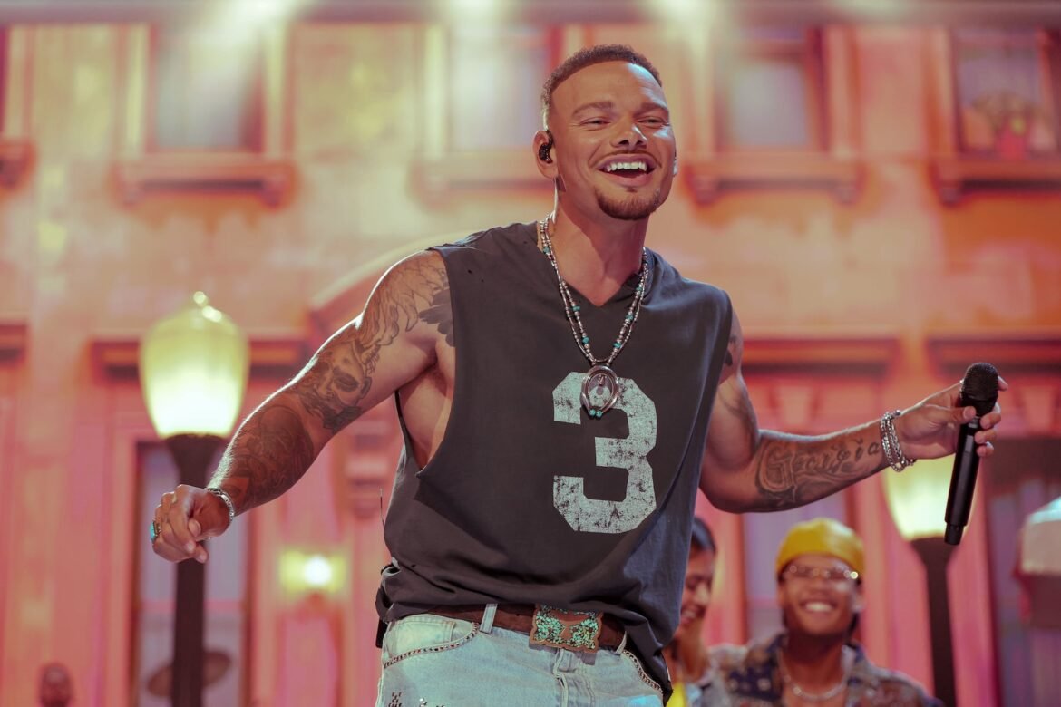 Country singer Kane Brown suffered an concussion and received 23 stitches after being hit with a golf ball. He can be seen here performing on stage at The 61st Academy of Country Music Awards held at MGM Grand Garden Arena on May 17 in Las Vegas, Nevada. (Photo by Christopher Polk/Dick Clark Productions via Getty Images)