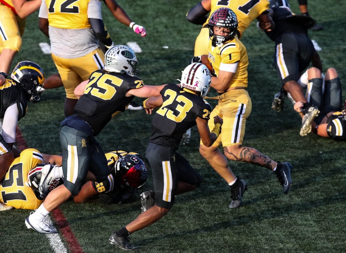 Andrew Avent (1) of North is turned around as he looks for more running room during the 2026 Phil Simms North South Football Classic at The College of New Jersey in Ewing, NJ on 6/20/26.