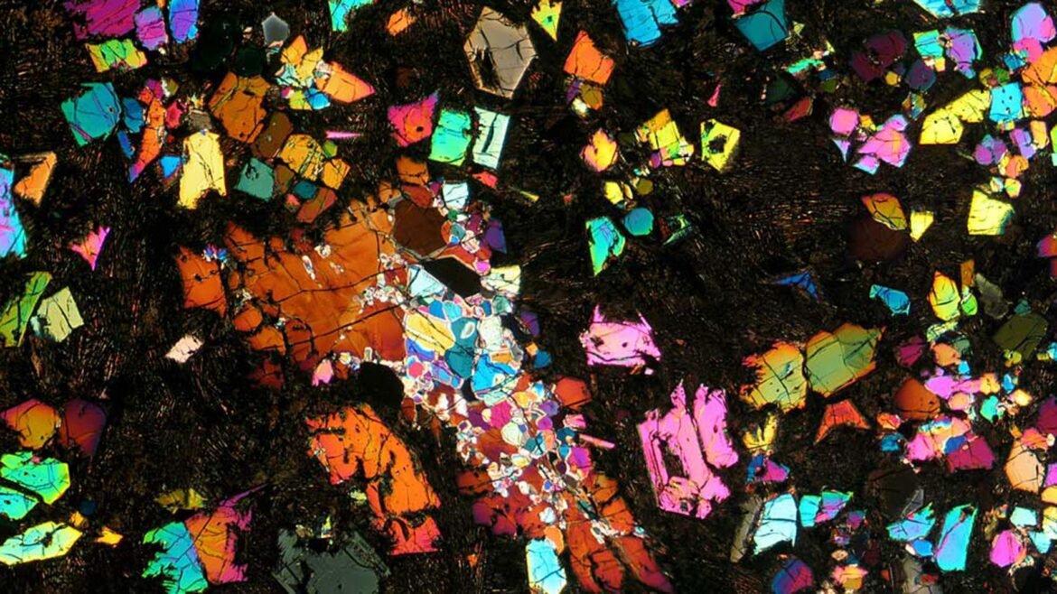 A kaleidoscope of colors is seen against a black background