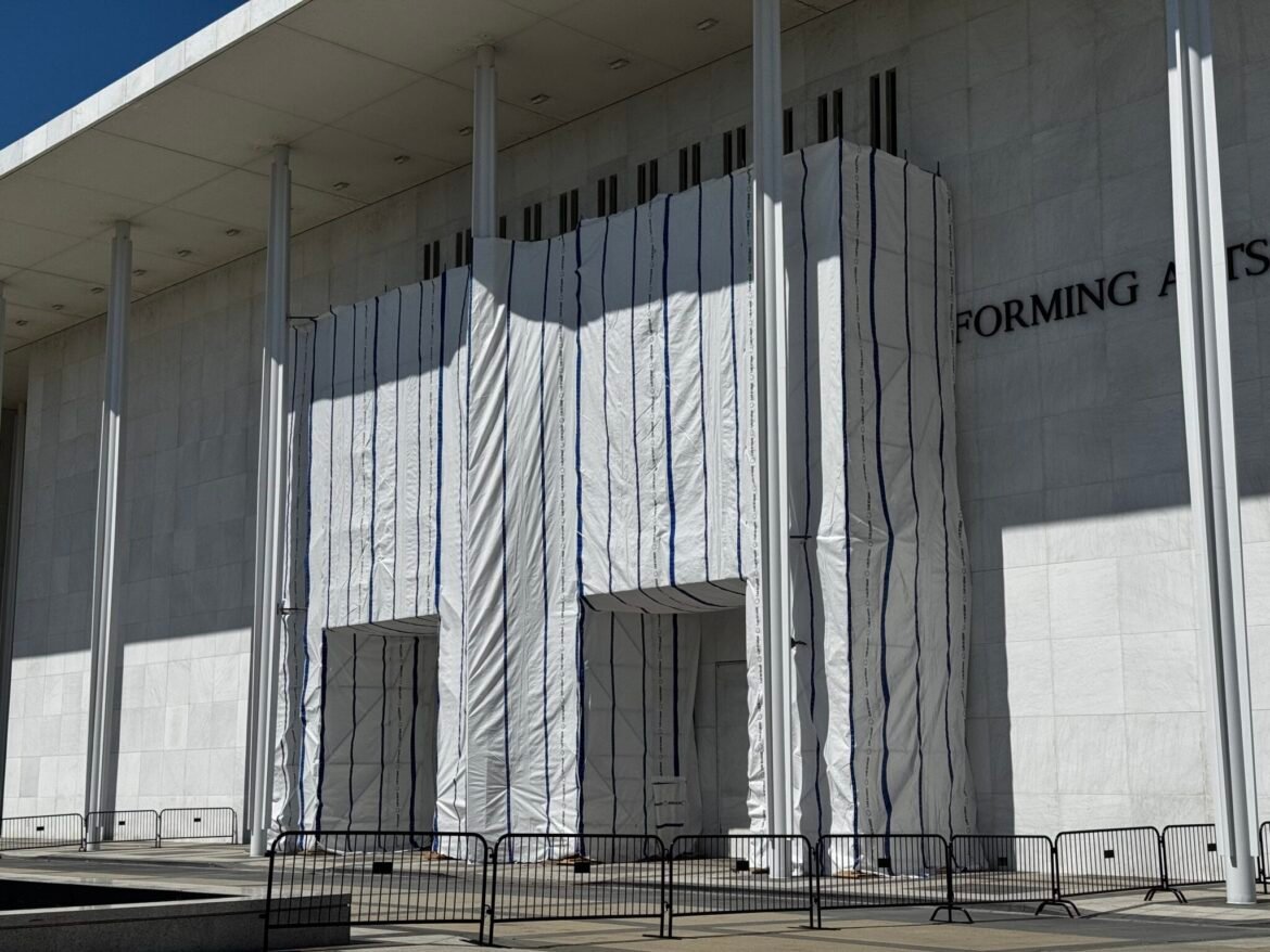 A weatherproof tarp covers the facade of the John F. Kennedy Center for the Performing Arts in Washington, D.C., on June 15, 2026. (Photo by Sam Gauntt/States Newsroom)