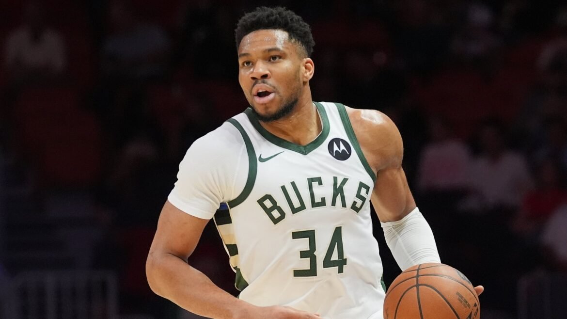 FILE - Milwaukee Bucks forward Giannis Antetokounmpo (34) dribbles the ball during the first half of an NBA basketball game against the Miami Heat, March 12, 2026, in Miami. (AP Photo/Marta Lavandier, File)