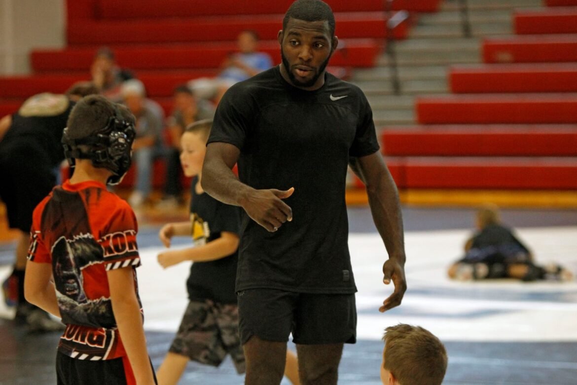 World medalist James Green instructs young wrestlers. Easton Area High School graduate and Nebraska associate head coach Bryan Snyder, and world medalist James Green held a wrestling clinic at Easton Area Middle School on Oct. 14, 2017. (Kyle Craig | For lehighvalleylive.com) EXT