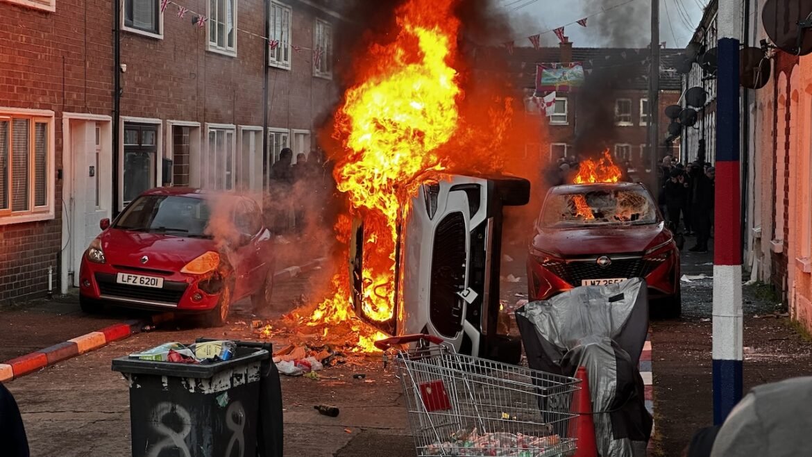 Vehicles burn in fire as riots flared in response to Monday night's stabbing attack in Belfast, Ireland.