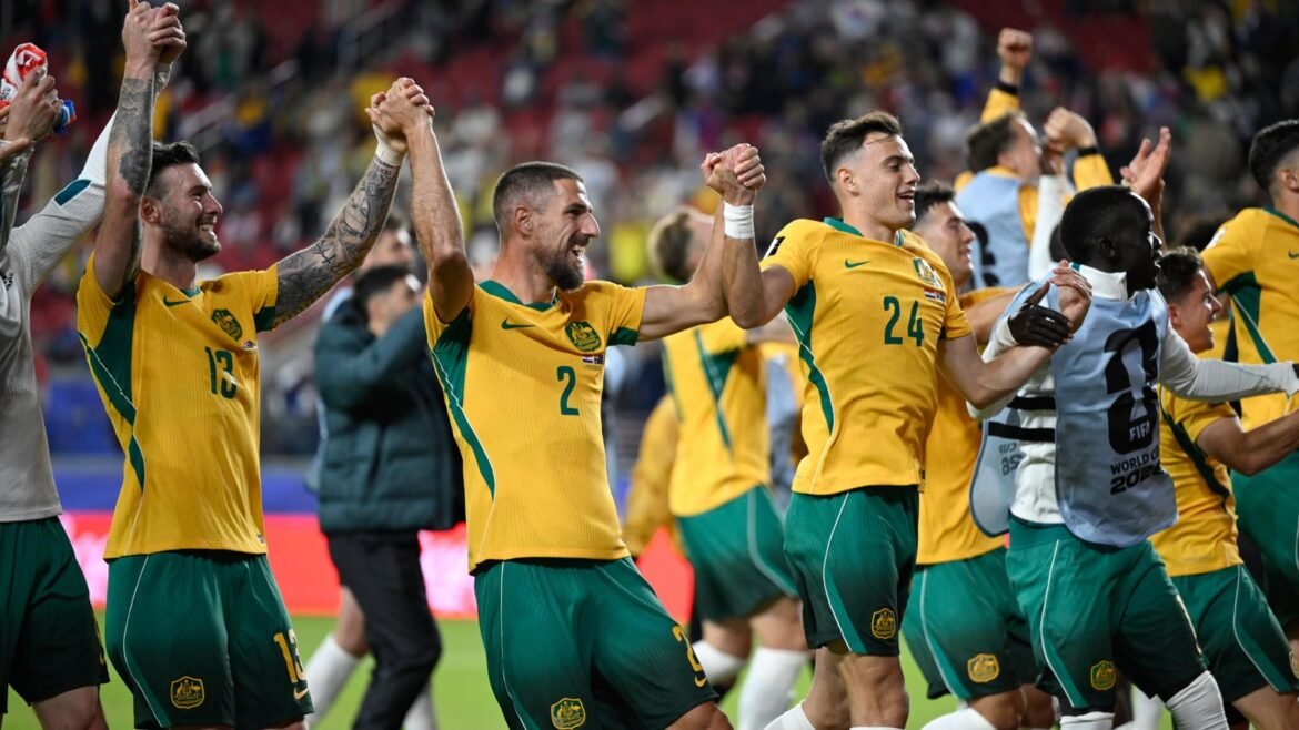 Australia celebrate reaching the World Cup last-32
