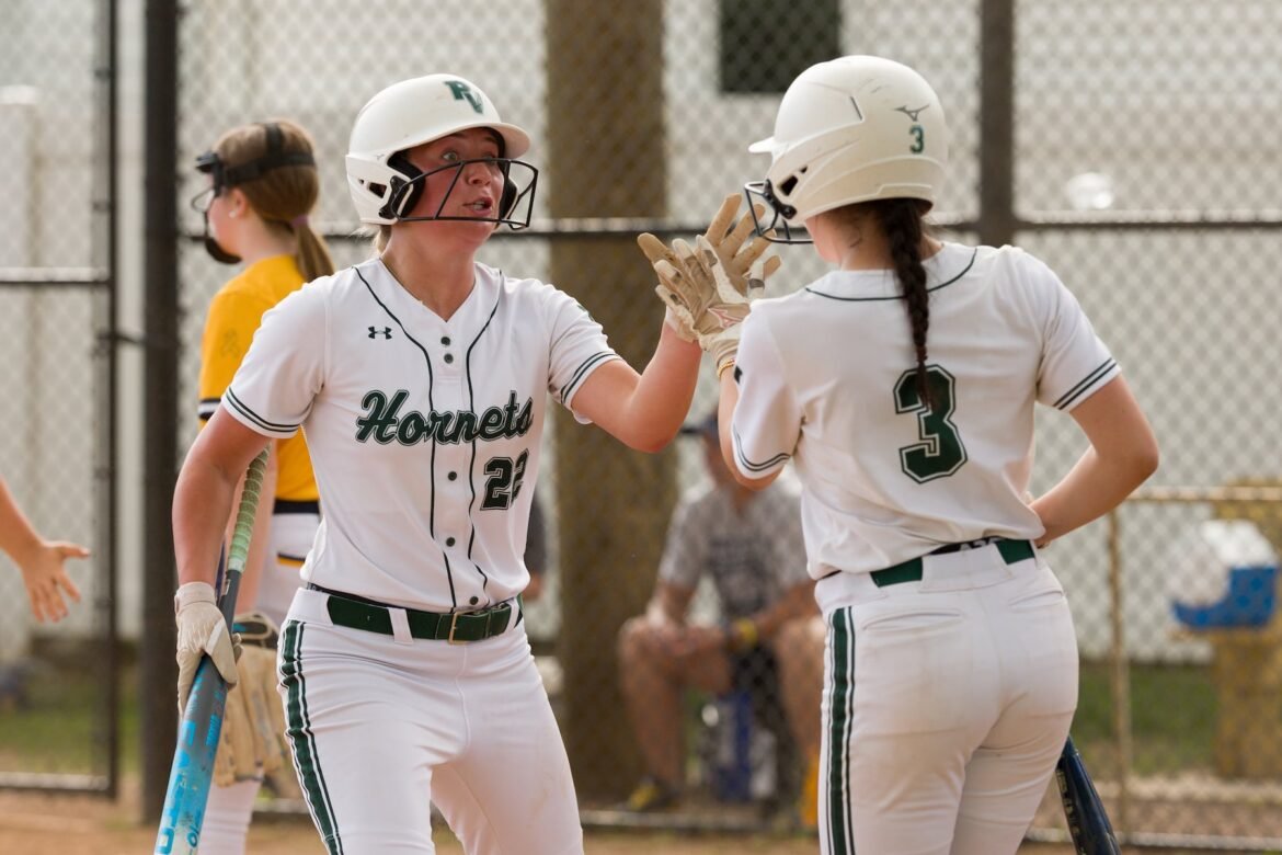 McKenzie Taylor of Passaic Valley (22) gets five from teammate Lily Allmendinger after scoring against Jefferson in the North 1, Group 2 high school softball quarterfinal on Thursday in Little Falls. The Hornets stung the Falcons, 10-3.  05/28/2026