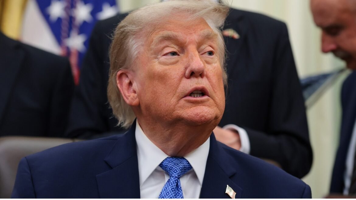 President Donald Trump seated