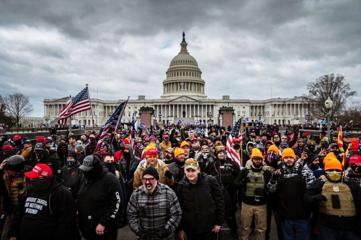 A mob of Trump supporters gathers in front of the U.S. Capitol Building on Jan. 6, 2021 in Washington, DC. An "anti-weaponization" fund was created by the Department of Justice in May 2026 that could make payments to those who took part in the Jan. 6 attack. (Photo by Jon Cherry/Getty Images)