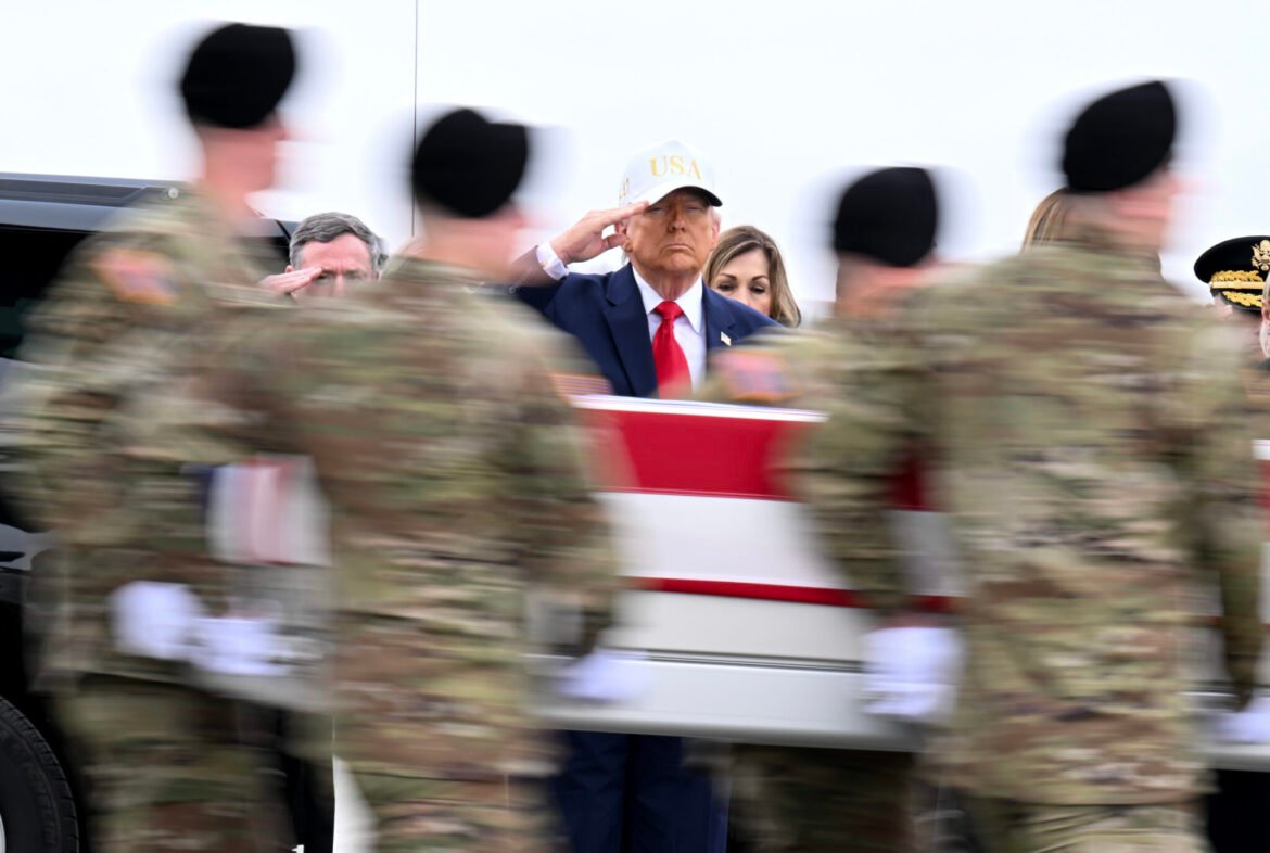 President Donald Trump salutes as a U.S. Army carry team moves a flag-draped transfer case containing the remains of Sgt. Declan J. Coady at Dover Air Force Base on March 7, 2026 in Delaware. Six soldiers from the 103rd Sustainment Command were killed in action by an Iranian drone strike on March 1 in Port Shuaiba, Kuwait. (Photo by Roberto Schmidt/Getty Images)