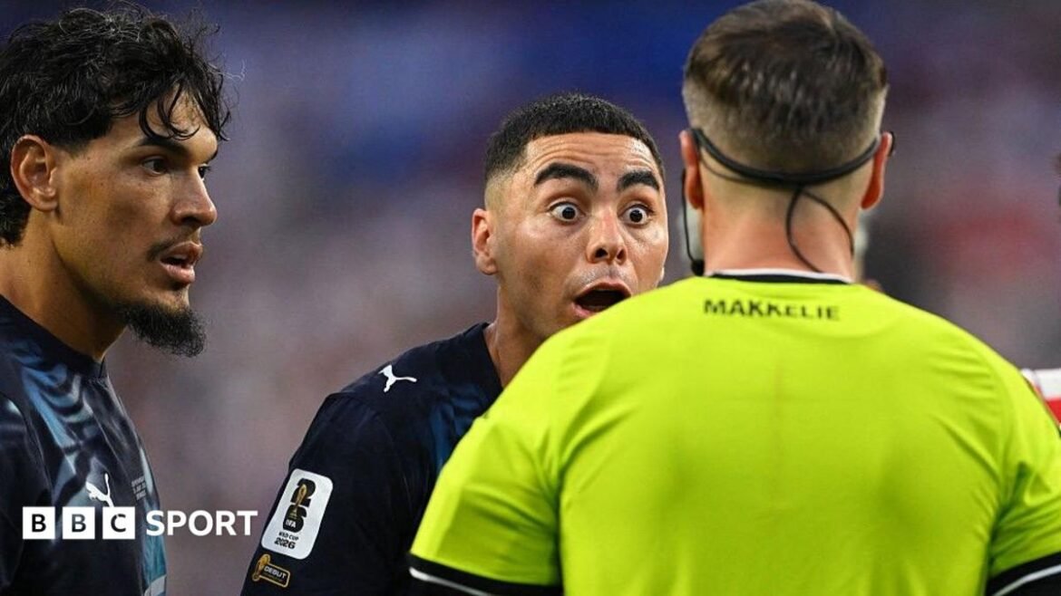Paraguay forward Miguel Almiron reacts to Dutch referee Danny Makkelie's decision to book him for diving