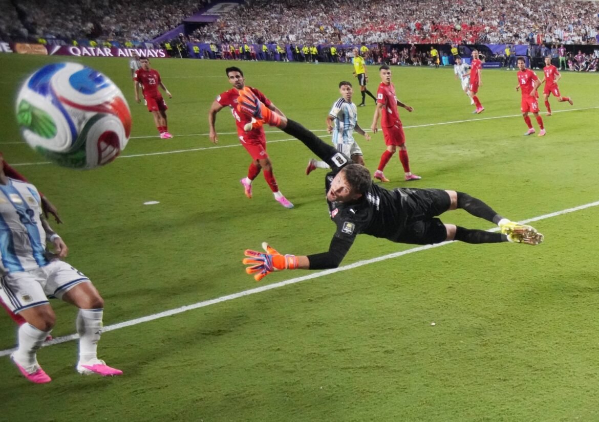 Argentina strike late in extra time to sink 10-man Swiss and reach World Cup semis