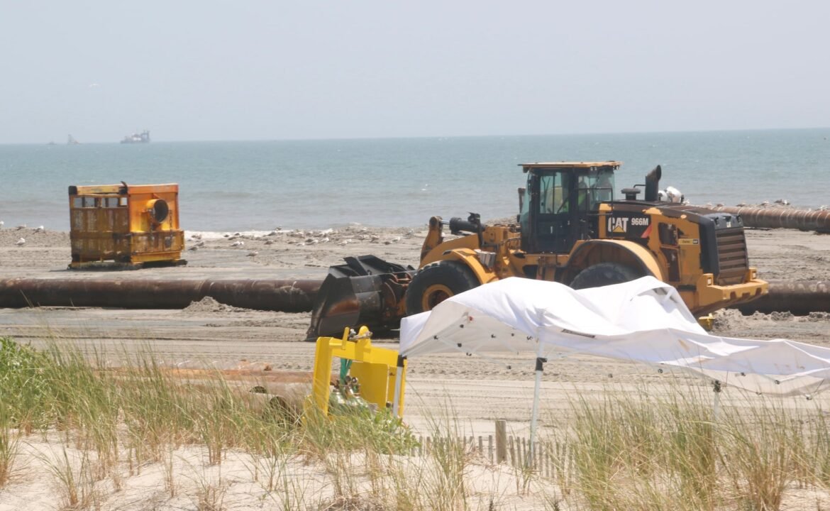 Bulldozers move sand around the beach in Sea Isle City, New Jersey, on Wednesday, July 1, 2026, as the U.S. Army Corps of Engineers completes a weeks-long nourishment project.