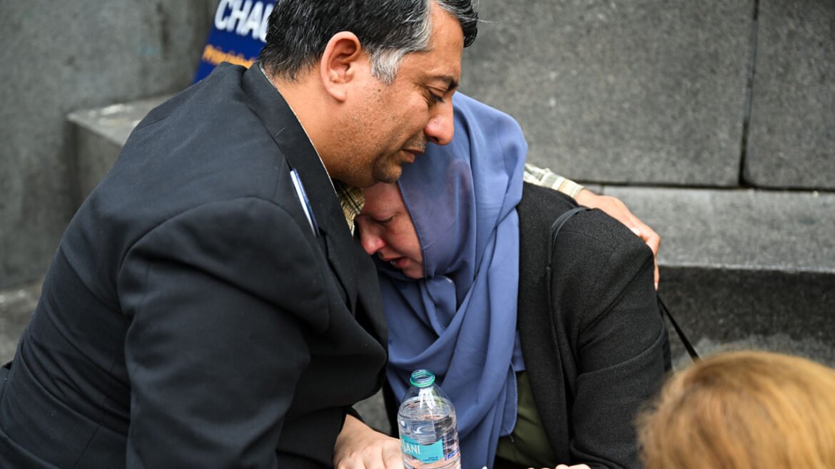 Two people cry during the memorial as hundreds of pro-Palestinian protesters gathered in Washington.