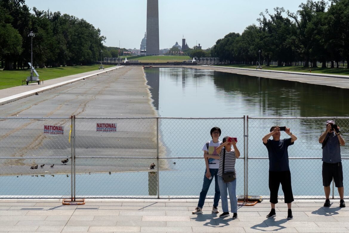 The drained Lincoln Memorial Reflecting Pool shows markings that appear similar to tire tracks as crews continue repair work at the Washington landmark. Officials have not confirmed the source of the impressions or whether they are connected to the pool’s recent damage. (AP Photo/Jose Luis Magana)